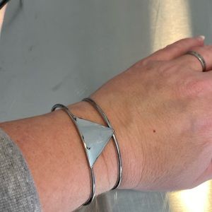 Bracelet. Silver in color.